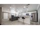 Modern kitchen with white cabinets, stainless steel appliances, and an island at 2803 E Pine St, Orlando, FL 32803