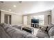 Comfortable living room with neutral walls, a large sectional, and plenty of natural light at 2803 E Pine St, Orlando, FL 32803