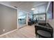 Cozy office featuring a desk, couch, and view of kitchen area, perfect for working from home at 2803 E Pine St, Orlando, FL 32803