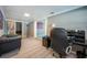 Home office features a desk, seating area, and view into another room at 2803 E Pine St, Orlando, FL 32803
