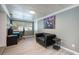 Well-lit office space with a desk, a couch, and a window with outdoor views at 2803 E Pine St, Orlando, FL 32803