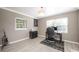Home office provides a comfortable workspace with natural light and a decorative rug at 2803 E Pine St, Orlando, FL 32803