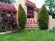 Condo entrance with landscaping and building signage at 2868 N Powers Dr # 5, Orlando, FL 32818