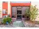 Exterior view of a home's patio with the house number, seating, and a welcome mat at 2868 N Powers Dr # 5, Orlando, FL 32818