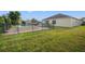 Spacious backyard with a pool and grassy area at 4032 Prairie Reserve Blvd, Orlando, FL 32824