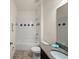 Bathroom featuring a tub, granite countertop, patterned tile backsplash, and tiled floors at 4032 Prairie Reserve Blvd, Orlando, FL 32824