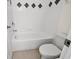 Clean bathroom with bathtub and tiled walls at 4032 Prairie Reserve Blvd, Orlando, FL 32824