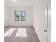 Bright bedroom with carpeted floor and large window at 4032 Prairie Reserve Blvd, Orlando, FL 32824
