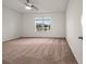 Spacious bedroom with large window and plush carpeting at 4032 Prairie Reserve Blvd, Orlando, FL 32824