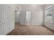Well-lit bedroom with access to a bathroom and hallway at 4032 Prairie Reserve Blvd, Orlando, FL 32824