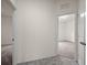 This hallway has neutral paint with two doors that lead to other rooms at 4032 Prairie Reserve Blvd, Orlando, FL 32824