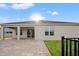 House exterior with covered patio and backyard at 4032 Prairie Reserve Blvd, Orlando, FL 32824