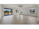 Spacious living room with tile flooring and sliding doors to patio at 4032 Prairie Reserve Blvd, Orlando, FL 32824