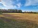 Large grassy field with a bench, providing an open green space at 4032 Prairie Reserve Blvd, Orlando, FL 32824