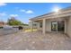 Outdoor patio with pavers, a built-in grill, and a covered lanai perfect for entertaining and relaxing at 4032 Prairie Reserve Blvd, Orlando, FL 32824