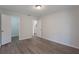 Bright bedroom with wood-look floors and closet at 5436 E Michigan St # 4, Orlando, FL 32812