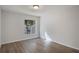 Well-lit bedroom featuring wood-look floors at 5436 E Michigan St # 4, Orlando, FL 32812