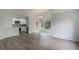 Open concept living space with modern kitchen and wood-look floors at 5436 E Michigan St # 4, Orlando, FL 32812