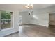 Spacious living room with large window and vaulted ceiling at 5436 E Michigan St # 4, Orlando, FL 32812