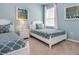 Bedroom with two twin beds, light blue walls, and window at 6112 Broad Oak Dr, Davenport, FL 33837