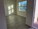 Bright living room with tile floors and a sliding glass door at 642 Duke Dr, Haines City, FL 33844