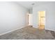 Spacious bedroom with an ensuite bathroom and carpet floors at 7051 Lanier Falls Rd, Deland, FL 32724