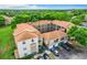 Aerial view of an apartment building with surrounding green space at 7350 Westpointe Blvd # 224, Orlando, FL 32835