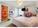 Charming bedroom featuring a double bed and playful decor at 7350 Westpointe Blvd # 224, Orlando, FL 32835