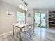 Dining area with table and chairs, and access to balcony at 7350 Westpointe Blvd # 224, Orlando, FL 32835