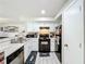 Modern kitchen with white cabinets and black appliances at 7350 Westpointe Blvd # 224, Orlando, FL 32835