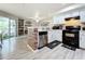 Open concept kitchen features stainless steel appliances and breakfast bar at 7350 Westpointe Blvd # 224, Orlando, FL 32835