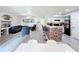 Open concept living, dining, and kitchen area with hardwood floors at 7350 Westpointe Blvd # 224, Orlando, FL 32835