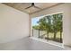 Spacious balcony with wood ceiling, ceiling fan, and black railing with a view to the outdoors at 7399 Gathering Ct, Reunion, FL 34747