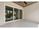 Covered balcony with tile floors and sliding glass doors with a scenic view at 7399 Gathering Ct, Reunion, FL 34747