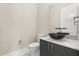 Contemporary powder room showcasing a stylish black vessel sink, marble countertop, and modern fixtures at 7399 Gathering Ct, Reunion, FL 34747