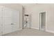 Bedroom with plush carpet, large closets, and doorways to other rooms of the house at 7399 Gathering Ct, Reunion, FL 34747