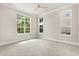 Bright bedroom with large windows offering ample natural light and neutral decor at 7399 Gathering Ct, Reunion, FL 34747