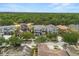 Charming two-story home with a well-manicured lawn and tree-lined street at 7399 Gathering Ct, Reunion, FL 34747