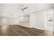 Bright hallway features hardwood floors, modern lighting, and access to upstairs living areas at 7399 Gathering Ct, Reunion, FL 34747