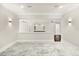Expansive carpeted living room with recessed lighting, ceiling fan, and bright lighting at 7399 Gathering Ct, Reunion, FL 34747