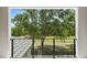 Scenic view of golf course from a balcony with black metal railing at 7399 Gathering Ct, Reunion, FL 34747
