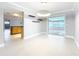 Dining area with open floor plan leading to living area and Florida room, showcasing natural light at 744 London Rd, Winter Park, FL 32792