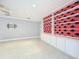 Living room with built-in shelving and wall-mounted TV at 744 London Rd, Winter Park, FL 32792