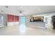 Living area with kitchen, built-in shelving and fireplace at 744 London Rd, Winter Park, FL 32792