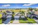 Aerial view showcasing three houses in a residential area at 8030 King Palm Cir, Kissimmee, FL 34747