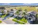 Aerial view of a residential neighborhood with houses and palm trees at 8030 King Palm Cir, Kissimmee, FL 34747
