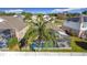 Aerial view of house with pool and surrounding homes at 8030 King Palm Cir, Kissimmee, FL 34747