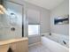 Bathroom with shower and garden tub at 8030 King Palm Cir, Kissimmee, FL 34747