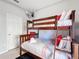 bedroom with bunk bed and grey walls at 8030 King Palm Cir, Kissimmee, FL 34747