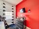 bedroom with red walls, dresser, and bunk bed at 8030 King Palm Cir, Kissimmee, FL 34747